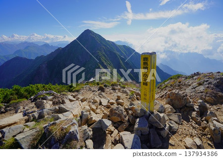 The summit marker of the north peak of Mt. Kashimayari and the south peak The summit marker of the north peak of Mt. Kashimayari and the south peak 137934386