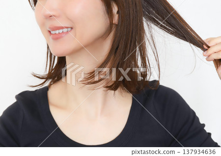 Woman touching her hair hair care 137934636