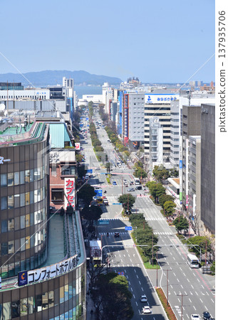 Ohakudori Street, in front of JR Hakata Station. You can see Hakata Bay and Shikanoshima Island. Photographed from the rooftop of the JR Hakata Station building. Ohakudori Street, in front of JR Hakata Station. You can see Hakata Bay and Shikanoshima Island. Photographed from the rooftop of the JR Hakata Station building. 137935706