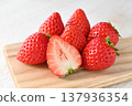 A cross-section of an Amarin strawberry and fresh strawberries 137936354