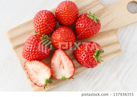 A cross-section of an Amarin strawberry and fresh strawberries A cross-section of an Amarin strawberry and fresh strawberries 137936355