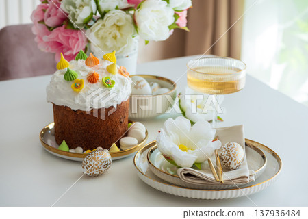 Elegant Easter Table Setting with Decorative Egg and Spring Details 137936484