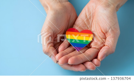 Colorful Heart Symbol of Love and Acceptance in Open Hands 137936704