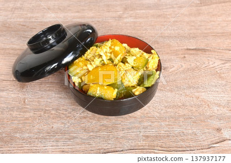stir fried pumpkin mixed with egg vegetarian food on bowl with lid 137937177