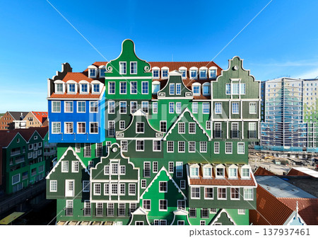 The famous Inntel hotel in the center of historical Zaandam, The Netherlands. Unique house facades. Dutch culture. The famous Inntel hotel in the center of historical Zaandam, The Netherlands. Unique house facades. Dutch culture. 137937461