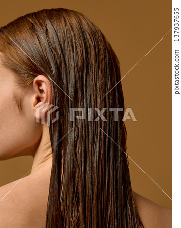 Wet straight hair close up texture after treatment in studio. 137937655