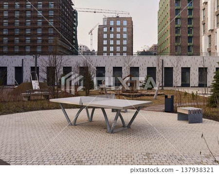 Public table tennis zone designed for residents in landscaped courtyard 137938321