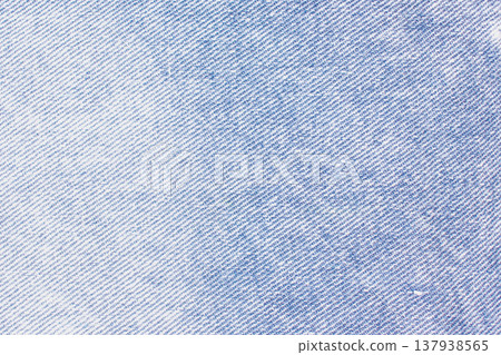 Classic blue denim texture with a distinct diagonal twill weave. Faded indigo tones and natural wear patterns create a versatile, vintage textile background Classic blue denim texture with a distinct diagonal twill weave. Faded indigo tones and natural wear patterns create a versatile, vintage textile background 137938565