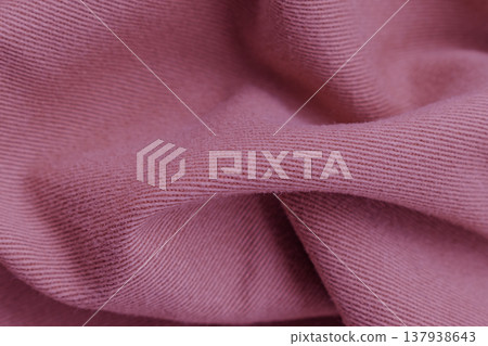 Deep burgundy denim-like cotton texture with heavy organic folds. The thick maroon fabric features a visible twill weave and soft shadows for a rich, tactile background Deep burgundy denim-like cotton texture with heavy organic folds. The thick maroon fabric features a visible twill weave and soft shadows for a rich, tactile background 137938643