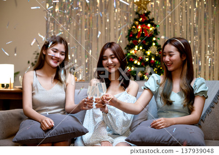 three young woman sitting in party pulling paper Shoot for fun three young woman sitting in party pulling paper Shoot for fun 137939048