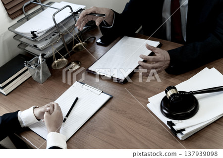 Lawyer manager elaborating on corporate legal Lawyer manager elaborating on corporate legal 137939098