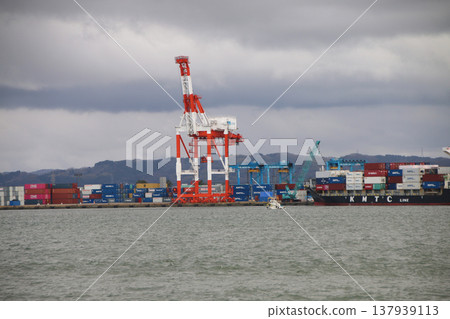 Large container ship docked at container terminal Large container ship docked at container terminal 137939113