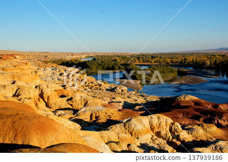 A panoramic view of the colorful landscape and rivers of Xinjiang's Five-Colored Beach. A panoramic view of the colorful landscape and rivers of Xinjiang's Five-Colored Beach. 137939186