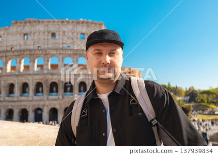 Happy 30s tourist smiling and taking a selfie photo at the Colosseum in Rome. Travel  137939834