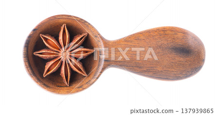 Star anise isolated on white background. Anise stars or badian spice in wooden spoon. Clipping path. Top view. 137939865