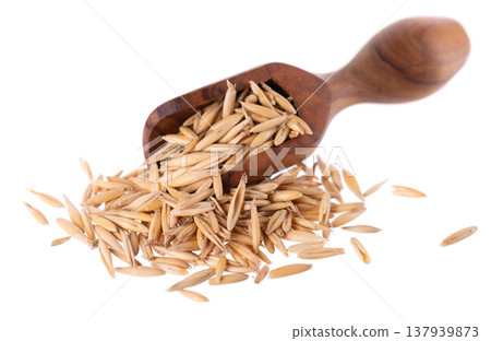 Unpeeled oat grains isolated on white background. Organic dry oat seeds in wooden spoon. Clipping path. Unpeeled oat grains isolated on white background. Organic dry oat seeds in wooden spoon. Clipping path. 137939873