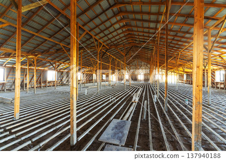 Inside Large Wooden Roof Framework Equipped With Scaffolding And Diverse Tools Visible 137940188