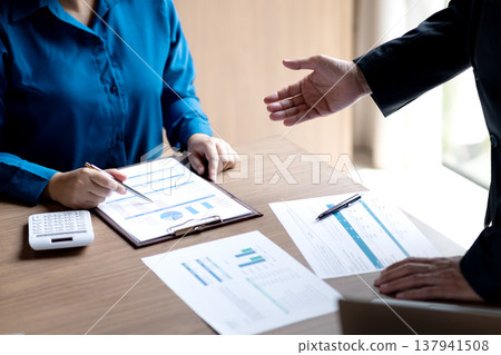 businessman executive is pointing with his hand for businesswoman businessman executive is pointing with his hand for businesswoman 137941508