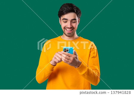 Handsome Man Surfing Internet On Smartphone. Guy Using Social Networks, Chatting 137941828