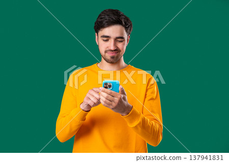 Bored Indifferent Man Scrolling Networks, Smartphone,Internet Addiction on Green 137941831