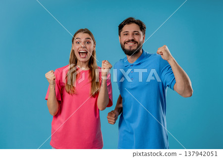 Happy Couple, Surprised Excited On Blue Background. Yeah, Yes, Jackpot Concept Happy Couple, Surprised Excited On Blue Background. Yeah, Yes, Jackpot Concept 137942051