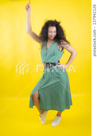 Happy woman pointing up with fun expression Happy woman pointing up with fun expression 137942126
