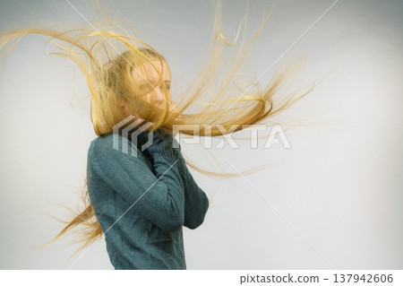 Sad girl with blowing hair Sad girl with blowing hair 137942606