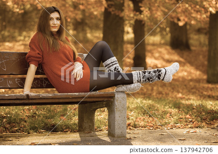 Beauty girl in autumnal time relax outdoors. Beauty girl in autumnal time relax outdoors. 137942706