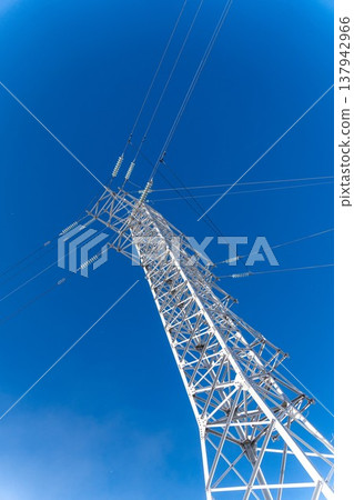 Low angle view of a white steel electricity transmission pylon Low angle view of a white steel electricity transmission pylon 137942966