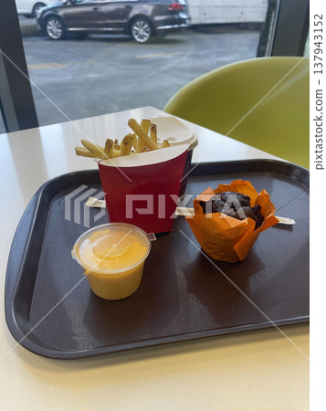potatoes fried with sauce and cake in open cafe potatoes fried with sauce and cake in open cafe 137943152