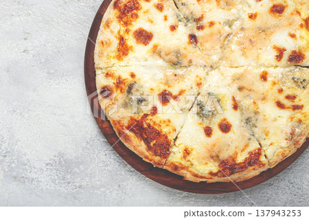 Freshly baked cheese pizza, white pizza, on a wooden plate, homemade, no people, 137943253