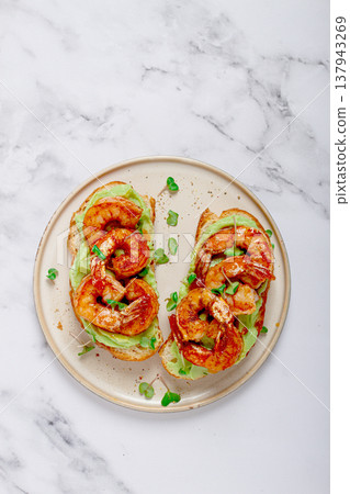 sandwiches with avocado and caramelized shrimp, micro-greens, breakfast, on a plate, top view, homemade, no people, 137943269