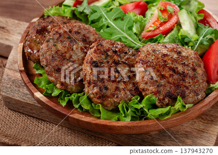 Fried cutlets, mixed minced meat, with vegetable salad, homemade, top view, no people, 137943270