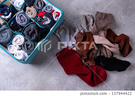 Decluttering concept. Organizing sock storage Decluttering concept. Organizing sock storage 137944422
