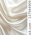 Elegant Soft Ivory Silk Fabric Draping with Smooth Curves and Subtle Highlights 137944909