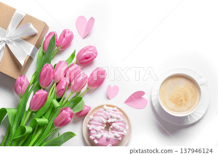 Conceptual template with pink tulips, coffee, donut and gift box. Valentine's Day, Mother's Day. 137946124
