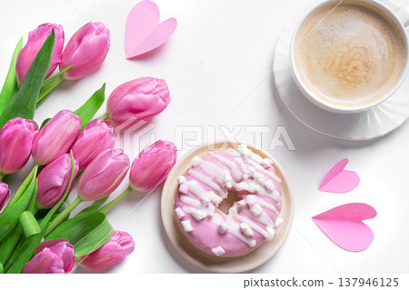 Conceptual template with pink tulips, coffee, donut and hearts. Valentine's Day, Mother's Day. 137946125