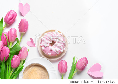Conceptual template with pink tulips, coffee, donut and hearts. Valentine's Day, Mother's Day. Conceptual template with pink tulips, coffee, donut and hearts. Valentine's Day, Mother's Day. 137946130