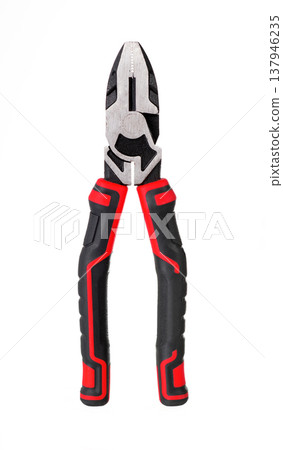Professional combination pliers with red and black ergonomic handles isolated on white. Metal hand tool. Professional combination pliers with red and black ergonomic handles isolated on white. Metal hand tool. 137946235