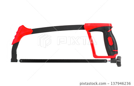Modern hacksaw with red and black handle isolated on white background. Professional metal cutting hand tool Modern hacksaw with red and black handle isolated on white background. Professional metal cutting hand tool 137946236
