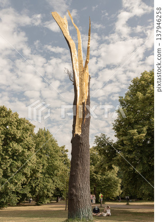 Located outside the Serpentine Gallery in Kensington Gardens, Giuseppe Penone Albero folgorato (Thunderstruck Tree) is a striking bronze and gold-leaf sculpture that mimics a tree trunk shattered by Located outside the Serpentine Gallery in Kensington Gardens, Giuseppe Penone Albero folgorato (Thunderstruck Tree) is a striking bronze and gold-leaf sculpture that mimics a tree trunk shattered by 137946258