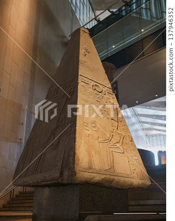 The top of an ancient Egyptian obelisk with reliefs and hieroglyphs The top of an ancient Egyptian obelisk with reliefs and hieroglyphs 137946352