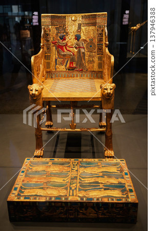 A ceremonial chair depicting an intimate scene between the king and queen, one of Tutankhamun's burial artifacts. 137946388
