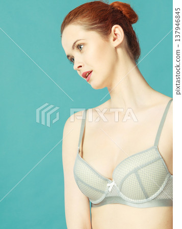 Woman in bra lingerie taking care of her breasts 137946845