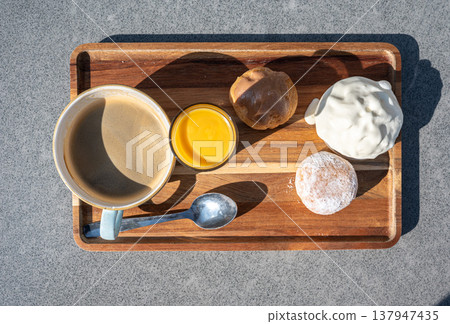 Flemish indulgent coffee set on sunny terrace Flemish indulgent coffee set on sunny terrace 137947435