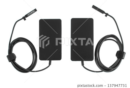 laptop power adapter, laptop spare part, on white background, top view laptop power adapter, laptop spare part, on white background, top view 137947731