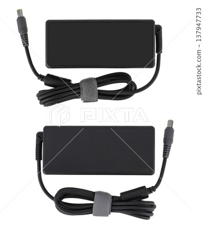laptop power adapter, laptop spare part, on white background, top view laptop power adapter, laptop spare part, on white background, top view 137947733