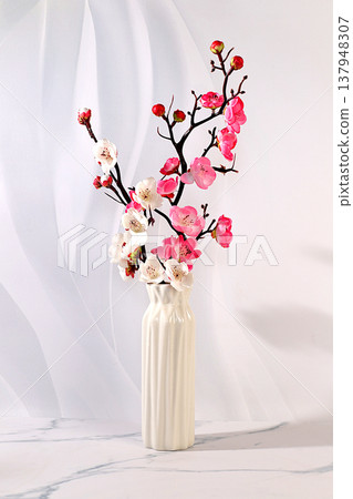 Elegant sunny colorful banner with pink blooming sakura branches in vase, abstract spring flower arrangement and template for your creative work, display table and spring concept, 137948307