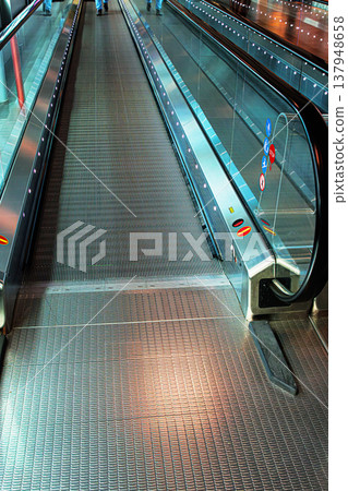 Empty moving walkway in an international airport. Travelator with perspective lines 137948658