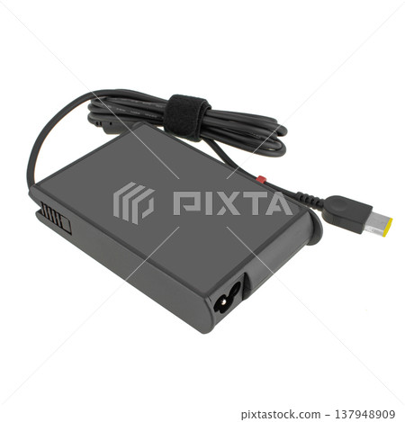 laptop power adapter, with a three-pin socket, on a white background laptop power adapter, with a three-pin socket, on a white background 137948909